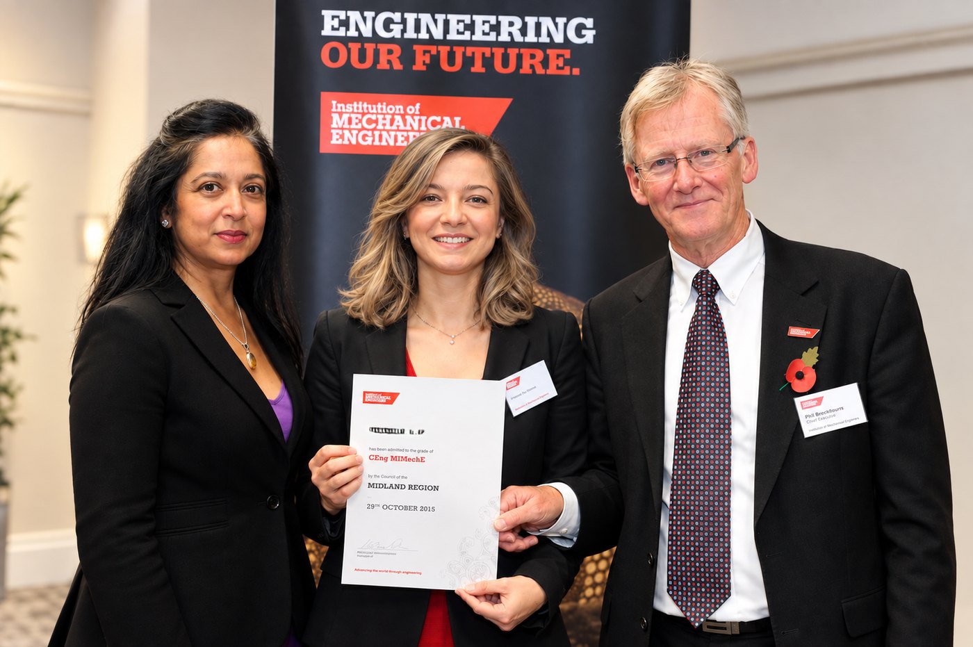 Deniz Caliskan receiving her CEng MIMechE certificate at the IMechE ceremony, October 2015